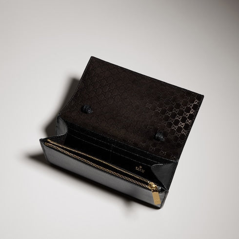 Wallet with strap and Gucci lettering