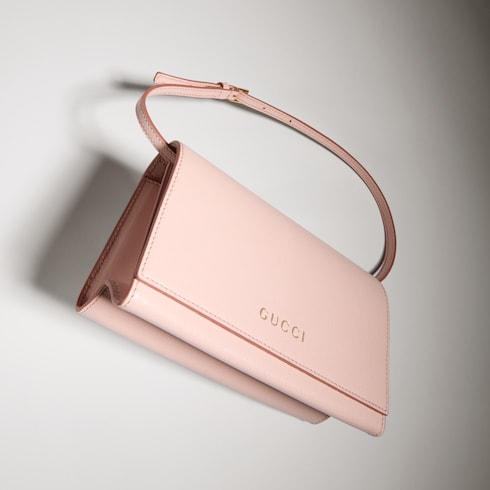 Mini pouch with Gucci lettering