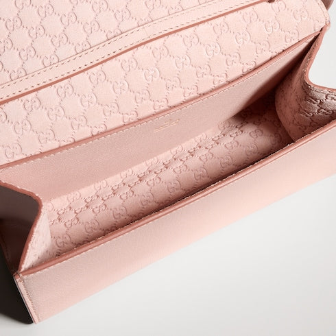 Mini pouch with Gucci lettering