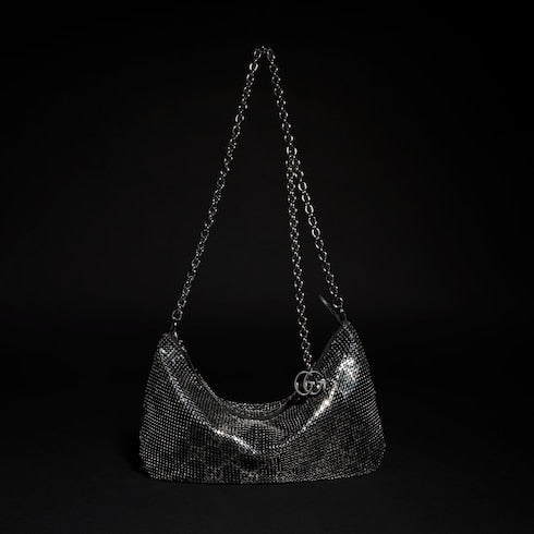 Metallic evening bag with charm