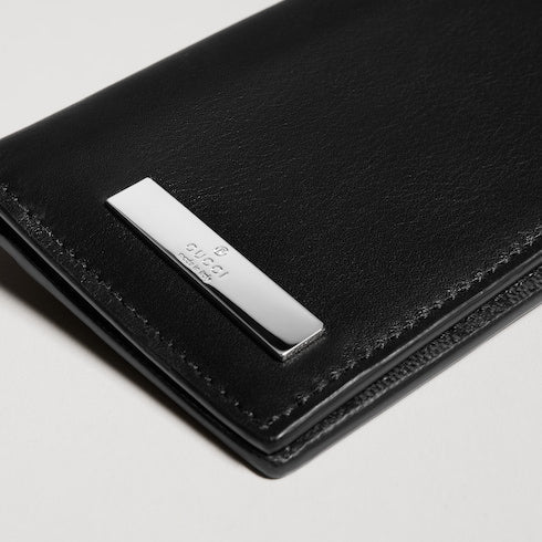 Card case with metal tag