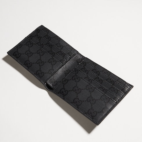 Bi-fold wallet with metal tag