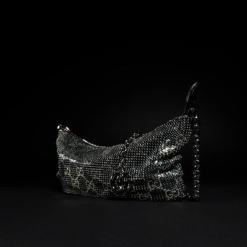 Metallic evening bag with charm