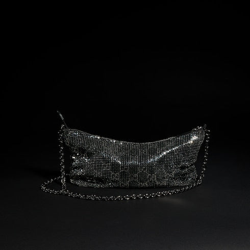 Metallic evening bag with charm