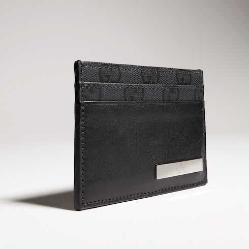 Card case with metal tag
