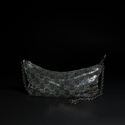Metallic evening bag with charm