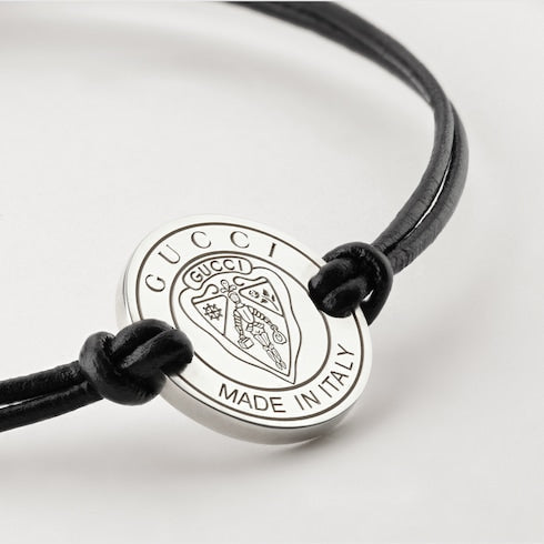Gucci crest leather cord bracelet with charm