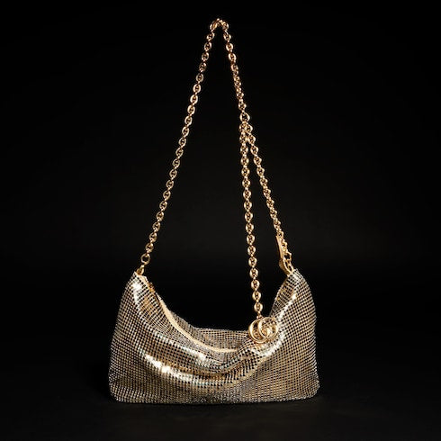 Metallic evening bag with charm