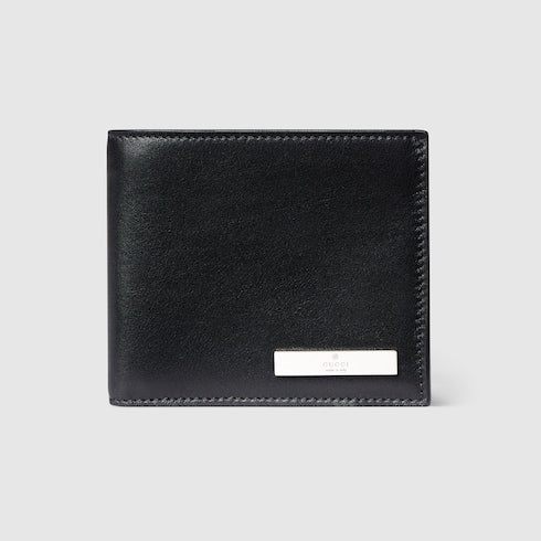 Bi-fold wallet with metal tag