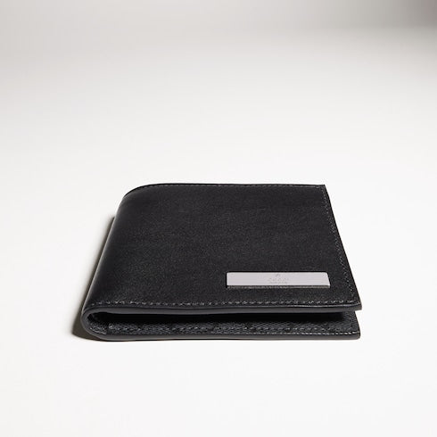 Bi-fold wallet with metal tag