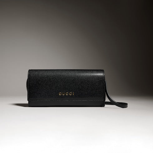 Wallet with strap and Gucci lettering