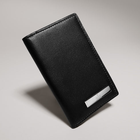 Card case with metal tag