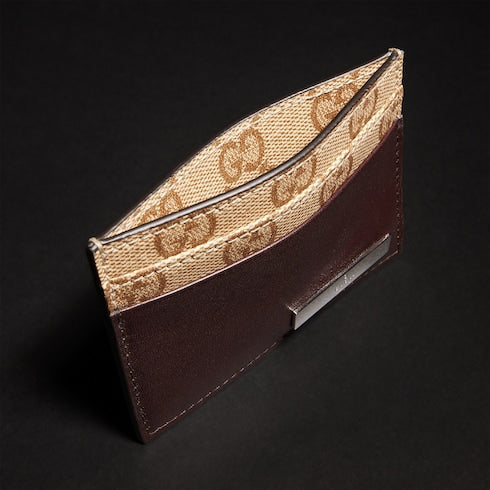 Card case with metal tag