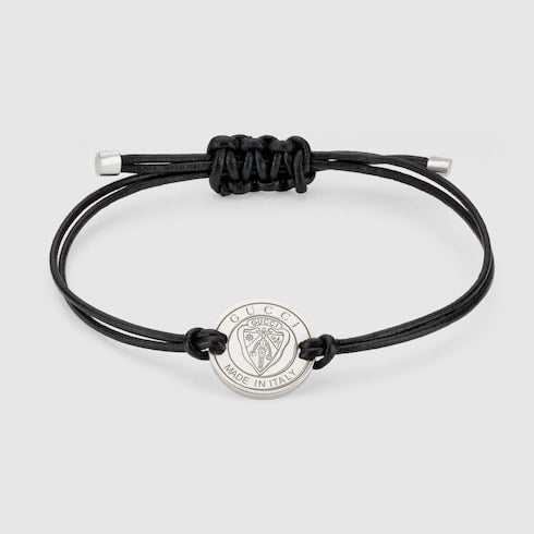 Gucci crest leather cord bracelet with charm