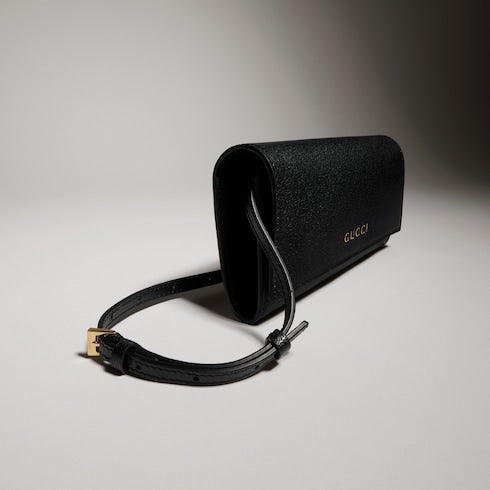 Wallet with strap and Gucci lettering
