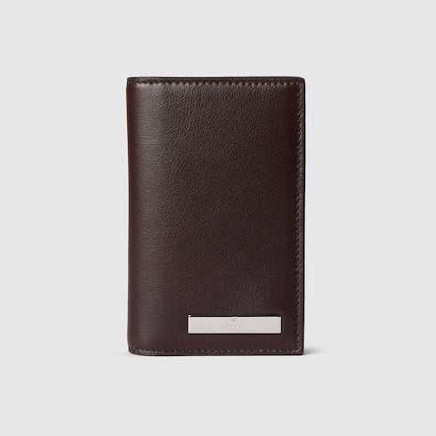 Card case with metal tag