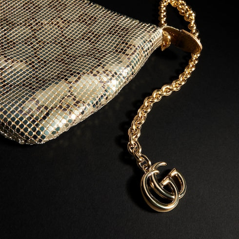 Metallic evening bag with charm