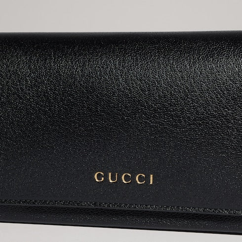 Mini pouch with Gucci lettering